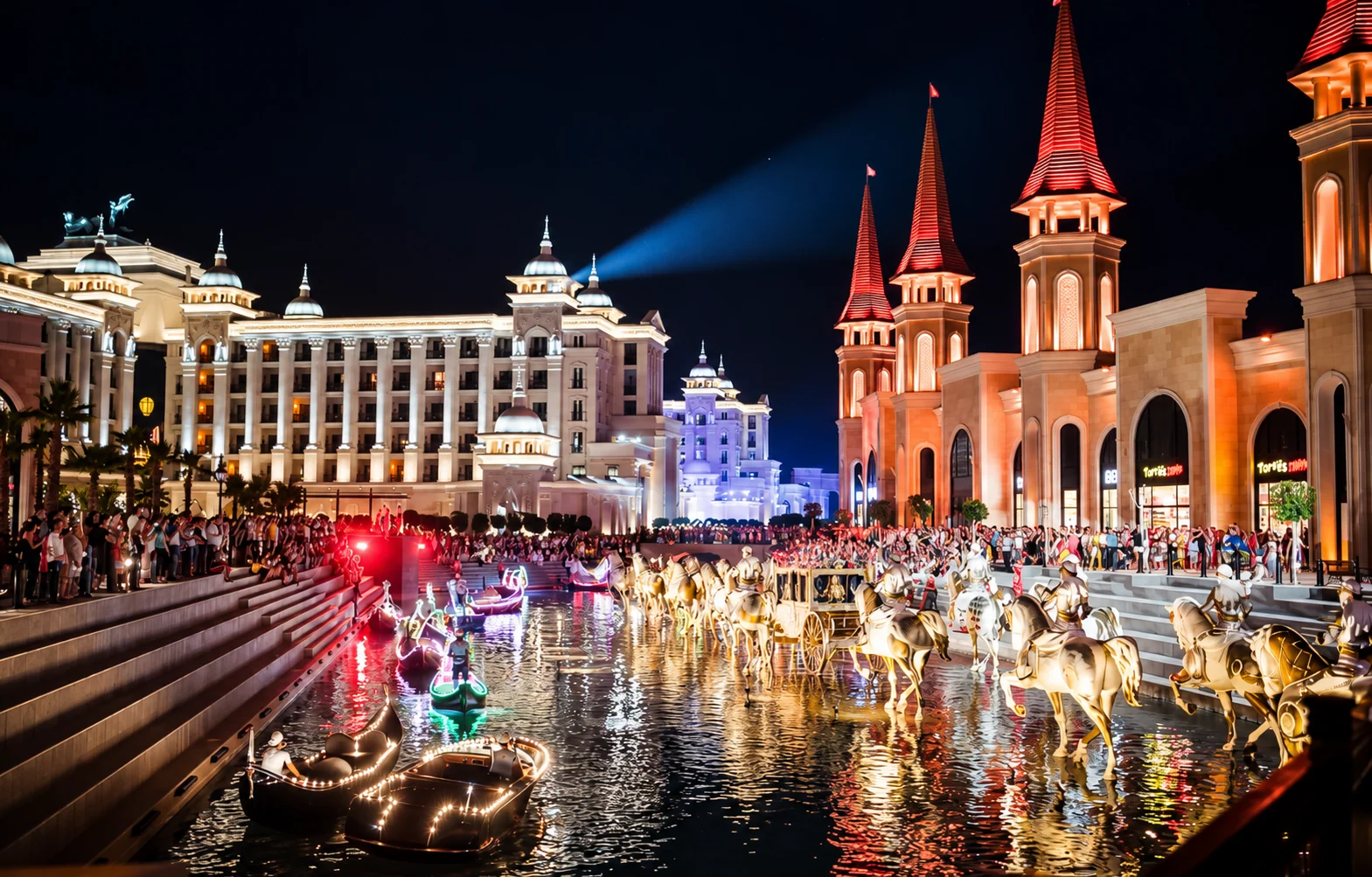 Evening lights, architecture and visitors beside The Land of Legends canal