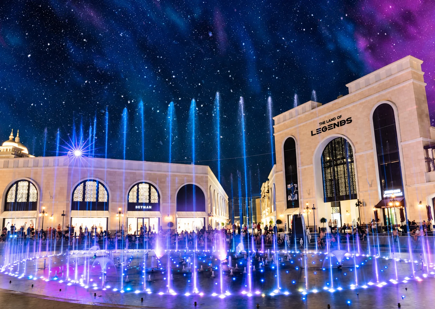 Night-time architecture and illuminated fountains at The Land of Legends